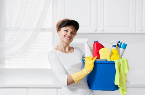 Carpet cleaners preparing equipment with safety measures in place