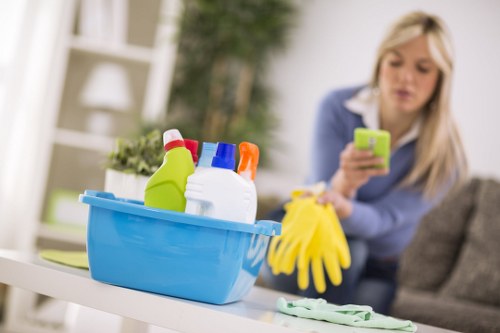 Trained carpet cleaner using protective gear during service