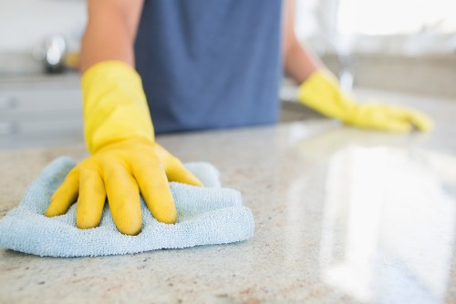 Careful oven cleaning in a compact W1S kitchen setting