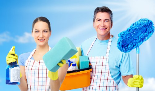 Carpet cleaning team reviewing health and safety practices